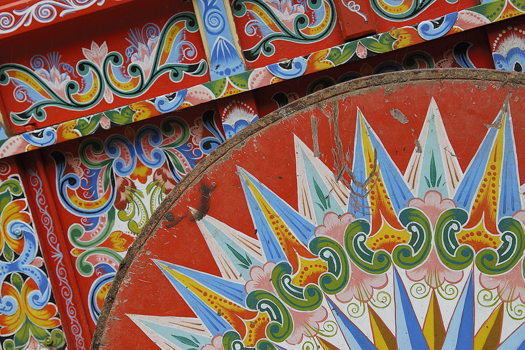 A detail of a colorfully pained ox cart, for which Costa Rica is known.