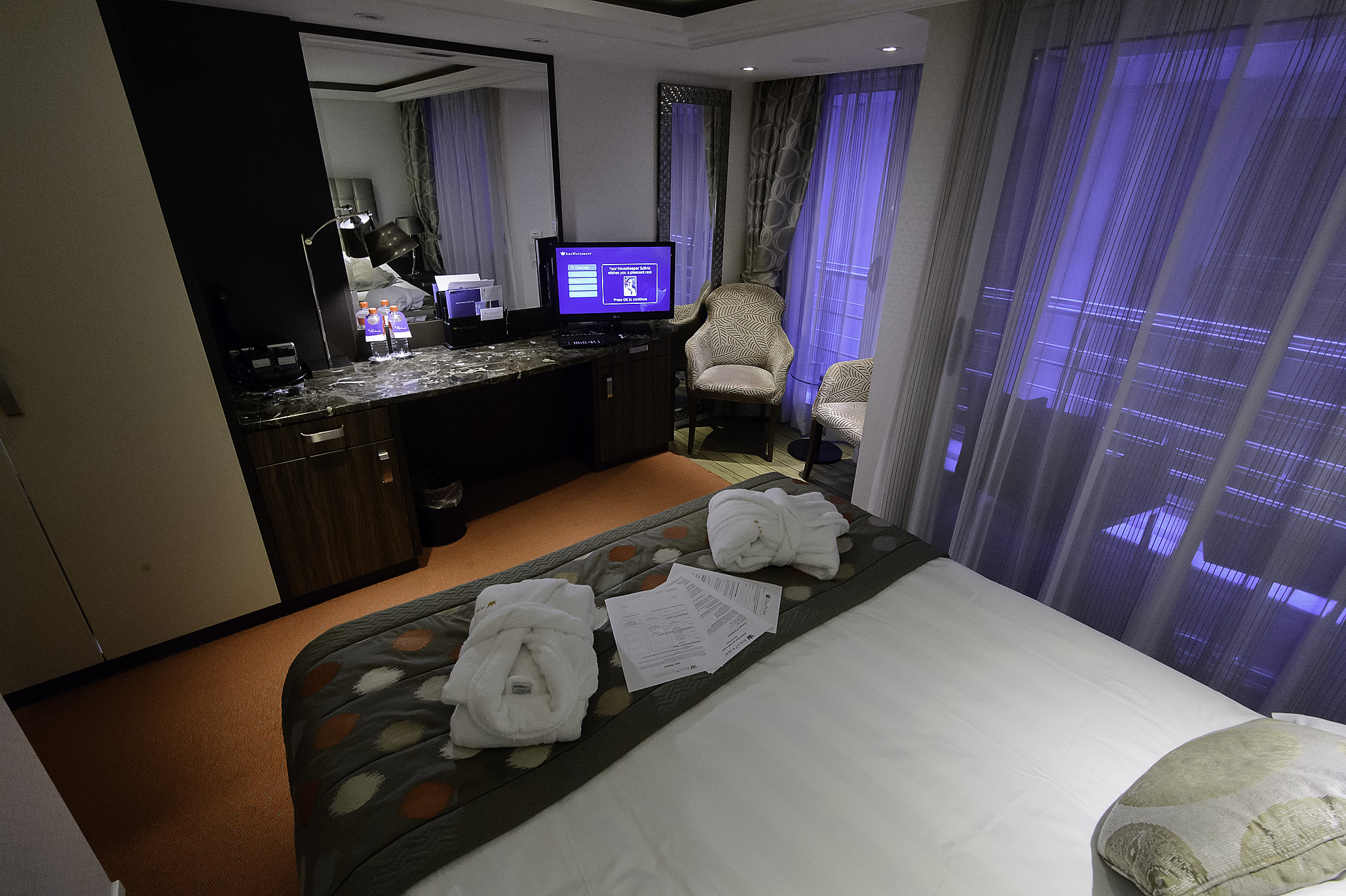 View to desk, and French/Outside balcony combo. On this class of river ship the combo balcony cabins have additional space, so the outdoor balcony does not take square footage from the room as compared to the regular french balcony only cabins. (see photo of Cabin 330 below to visualize this.)