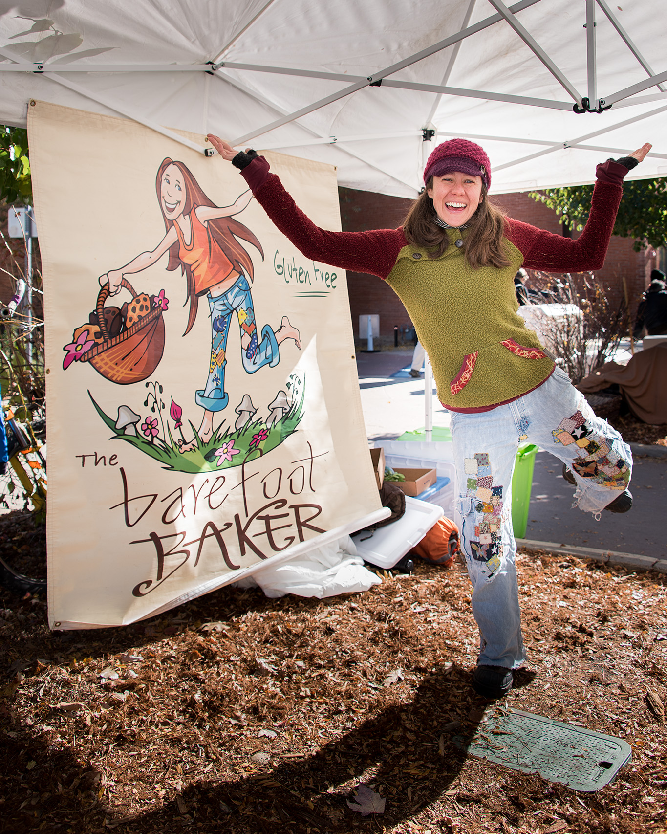 Natasha, wearing her favorite patchwork jeans at her gluten free baked goods booth at the Boulder County Farmers Market