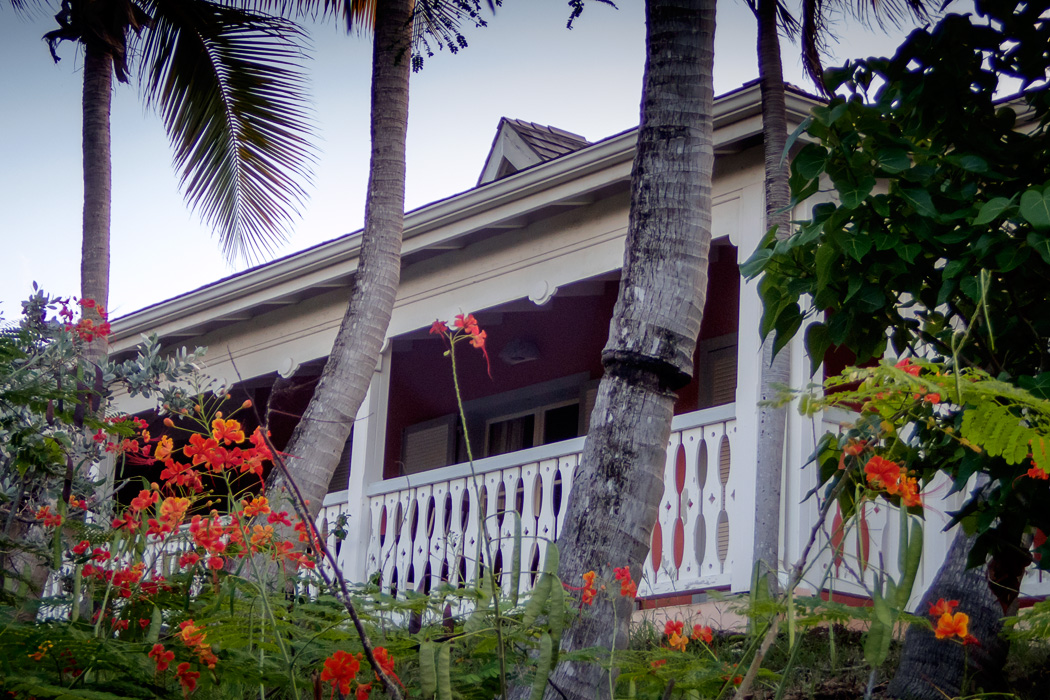 Balcony of a villa at La Plantation. Each Villa has 3 units; 2 studios on the end, and a larger suite in the middle. A large balcony wraps around the whole building, but each is separated by barrier which can be opened if the villa is rented as a unit. If you don't need a large kitchen and living room, consider renting the smaller studio end unit which provides more privacy as the balcony wraps around and there is only one shared wall. 