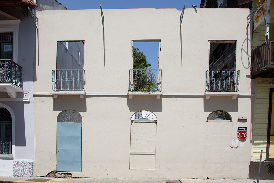 Laws require owners to maintain a facade, even on empty lots.