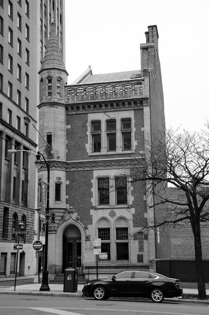 This little building on State St is available, with incredible details, it sits all alone!