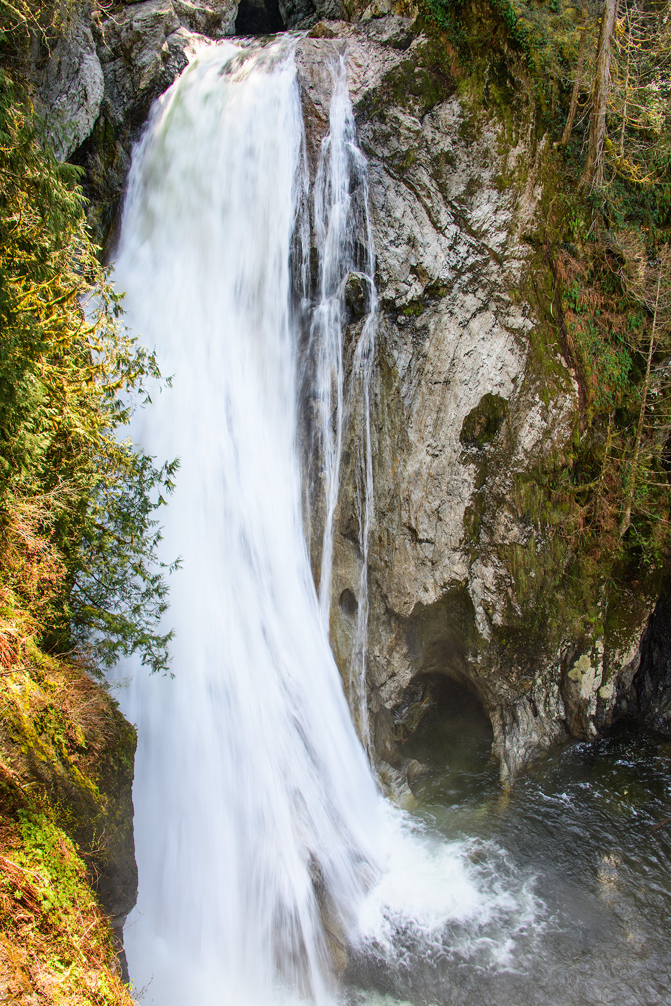 The rushing falls above a "small cave" - for perspective, you could probably fit a Mini Cooper in that "small cave"