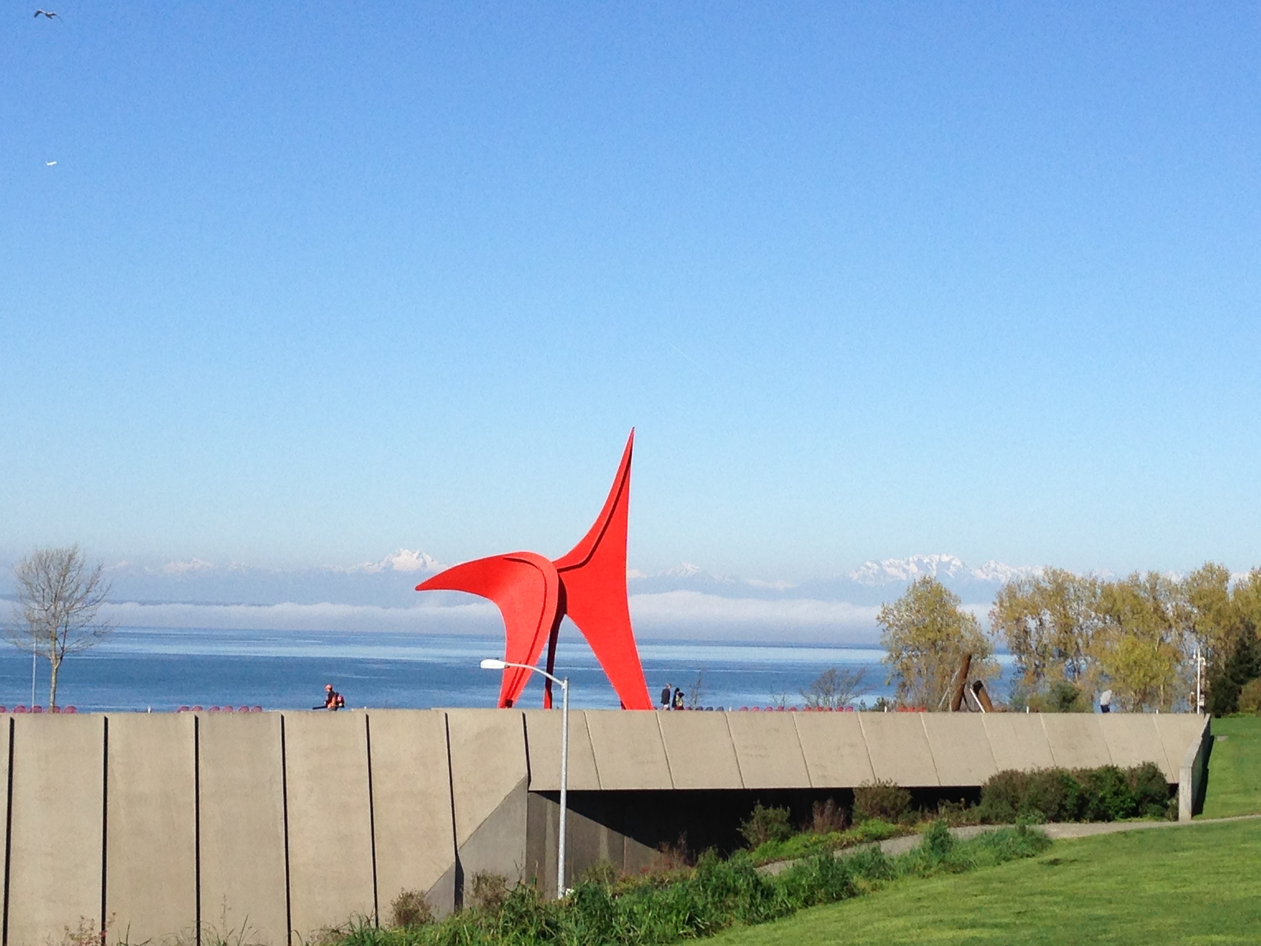 Seattle Art Museum Olympic Sculpture Park with mountain views beyond.