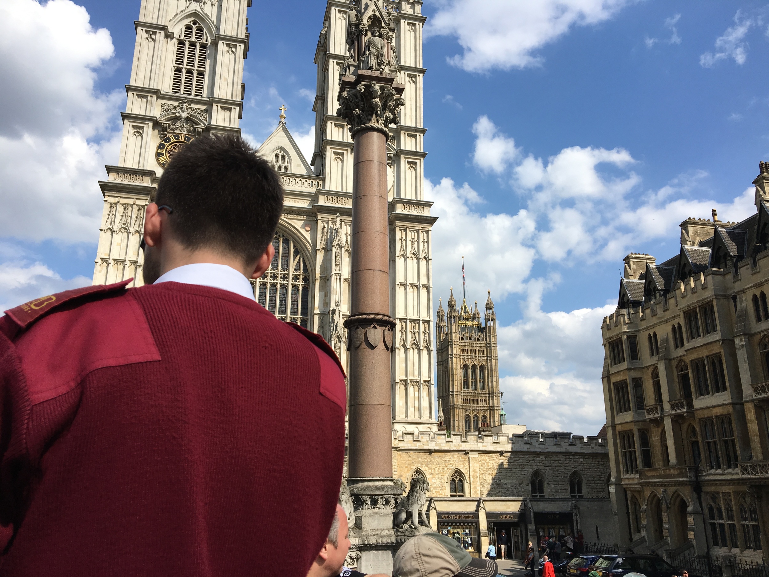 A guided Hop On Hop Off bus was one way to see a lot of the city in short time, here the guide narrates at Westminster Abbey. 