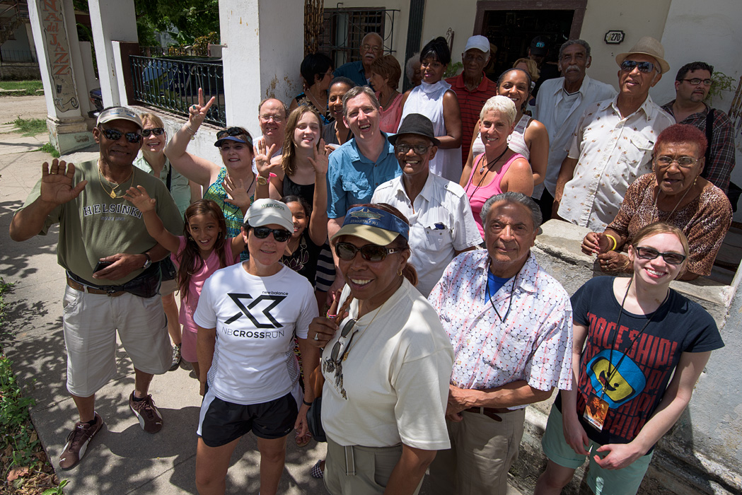 Members of our group and a Cuban senior dance group (and their grandchildren) posing on the porch of their community center after we had dance lessons. 