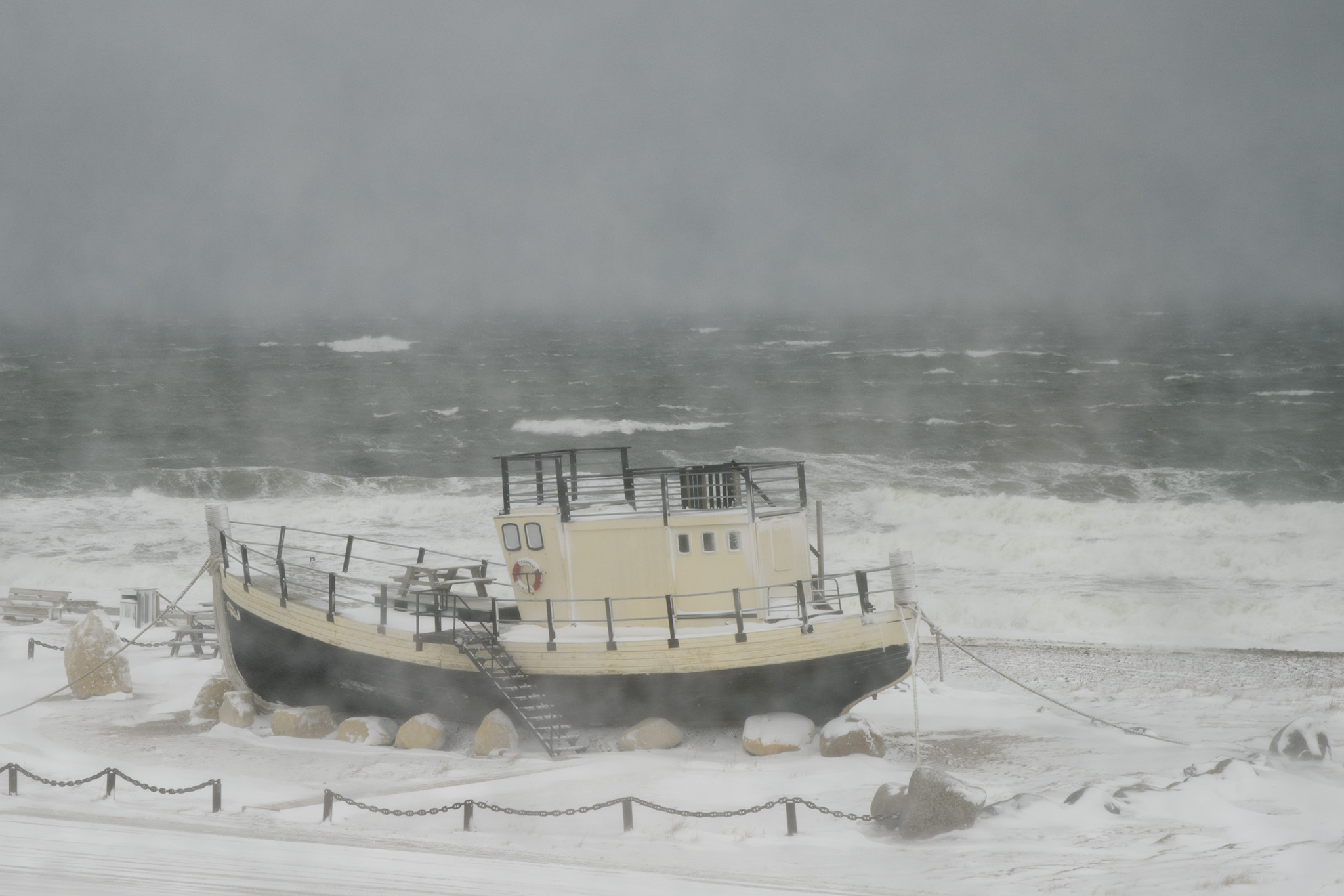 The Hudson Bay will be covered in ice by mid November, when the polar bears will head out onto the ice to feed on seals. This view of the bay is from a public park, where a small decommissioned tug boat was left in the park by the shore as a shelter if a polar bear is in the area. Its said polar bears don't like stairs, so being up on the tug would provide some safety until the bear moves on.