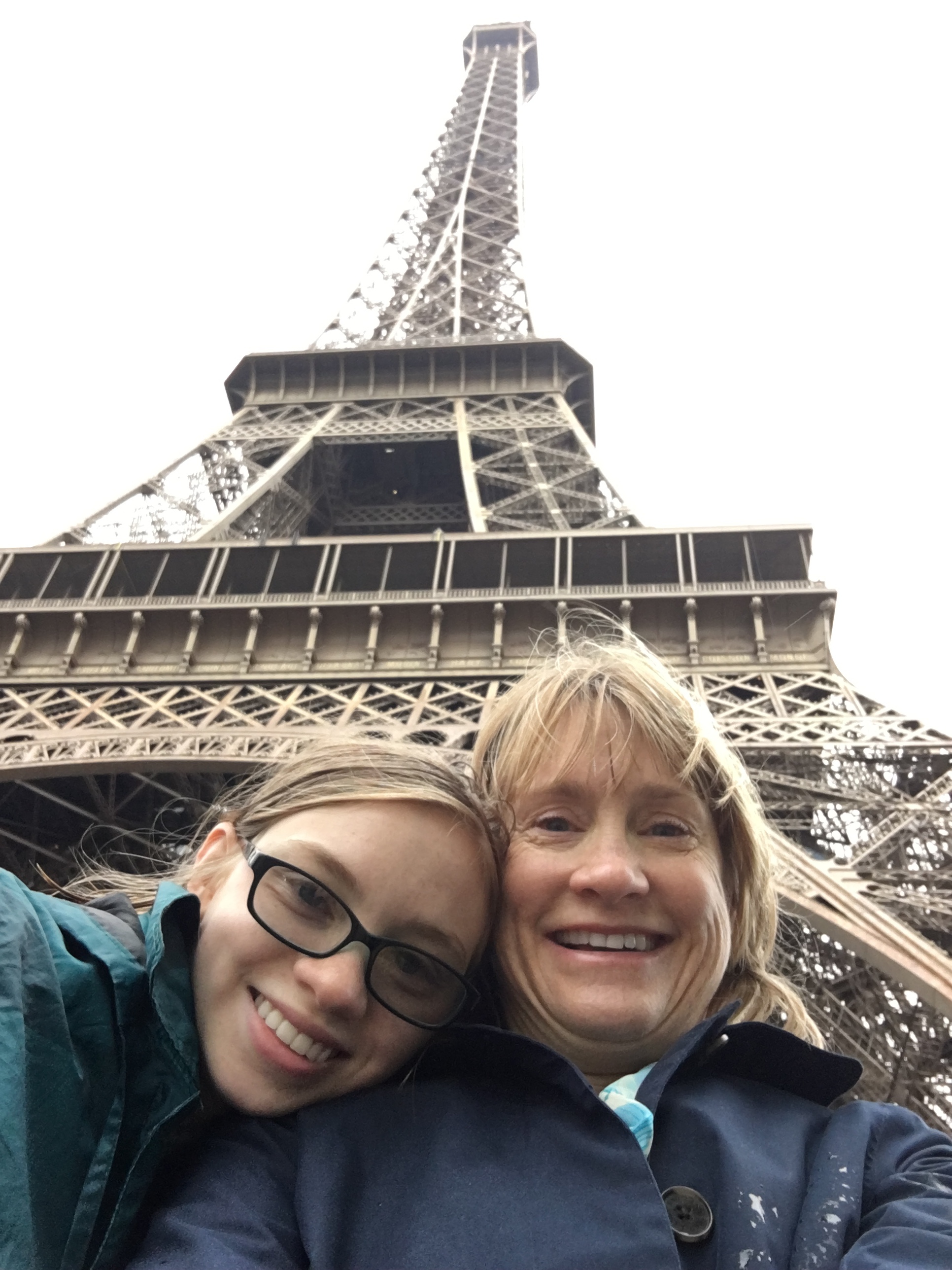 Early, rainy, and not quite high season! By following my tips for tourist destinations, we took an Eiffel selfie with no other photobombing tourists around!