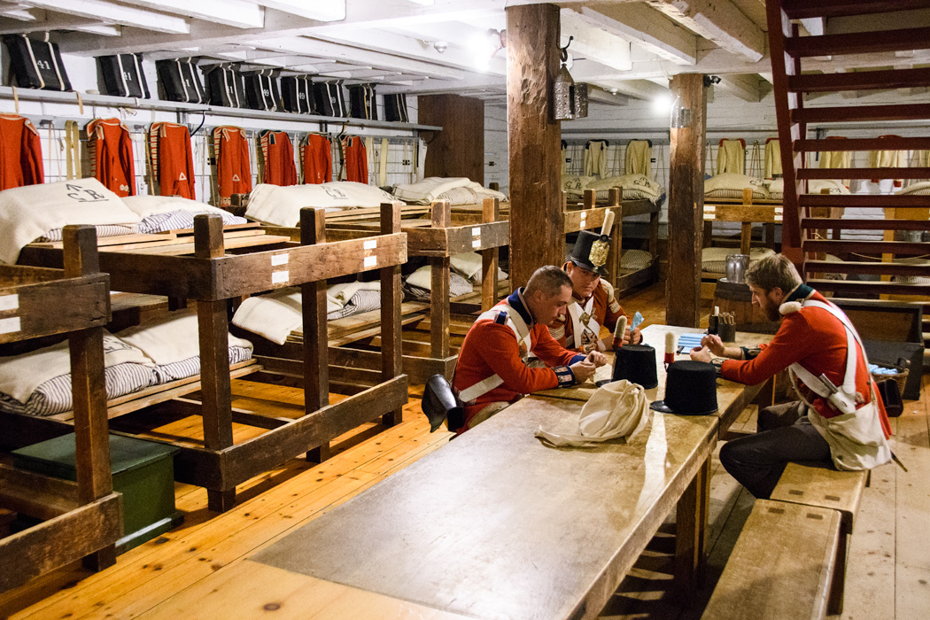 Re-enactors prepare powder for muskets in the barracks at Ft George at Niagara on the Lake. 