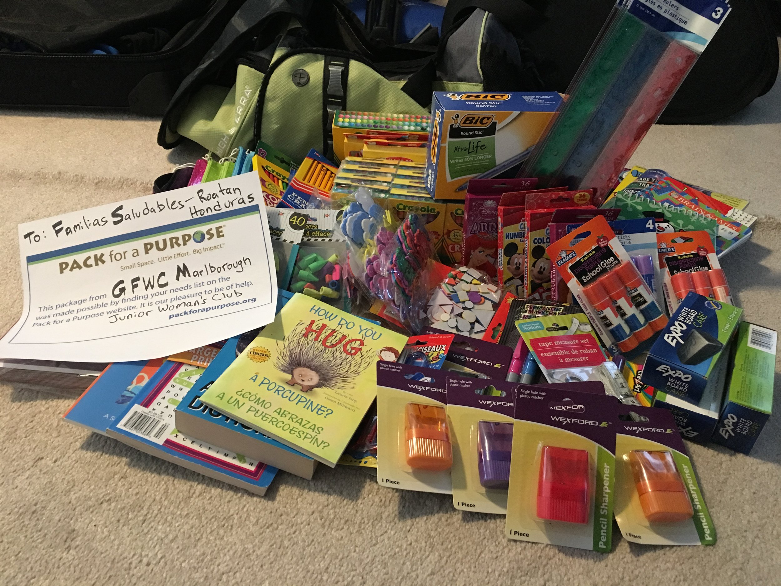 The GFWC Marlborough Junior Woman's Club helped collect school supplies, and after this photograph, I removed most of the plastic packaging as requested by PfP, to lessen the financial burden of trash removal for organizations serving vulnerable islanders. 