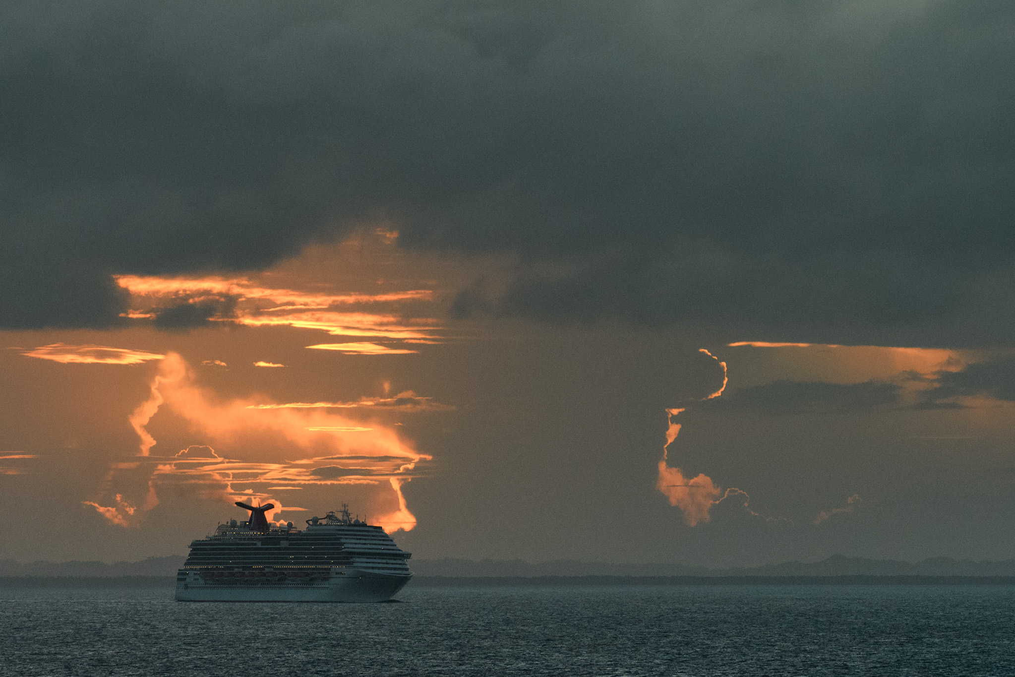 A Carnival ship is silhouetted by the dramatic sunset as we left Belize.