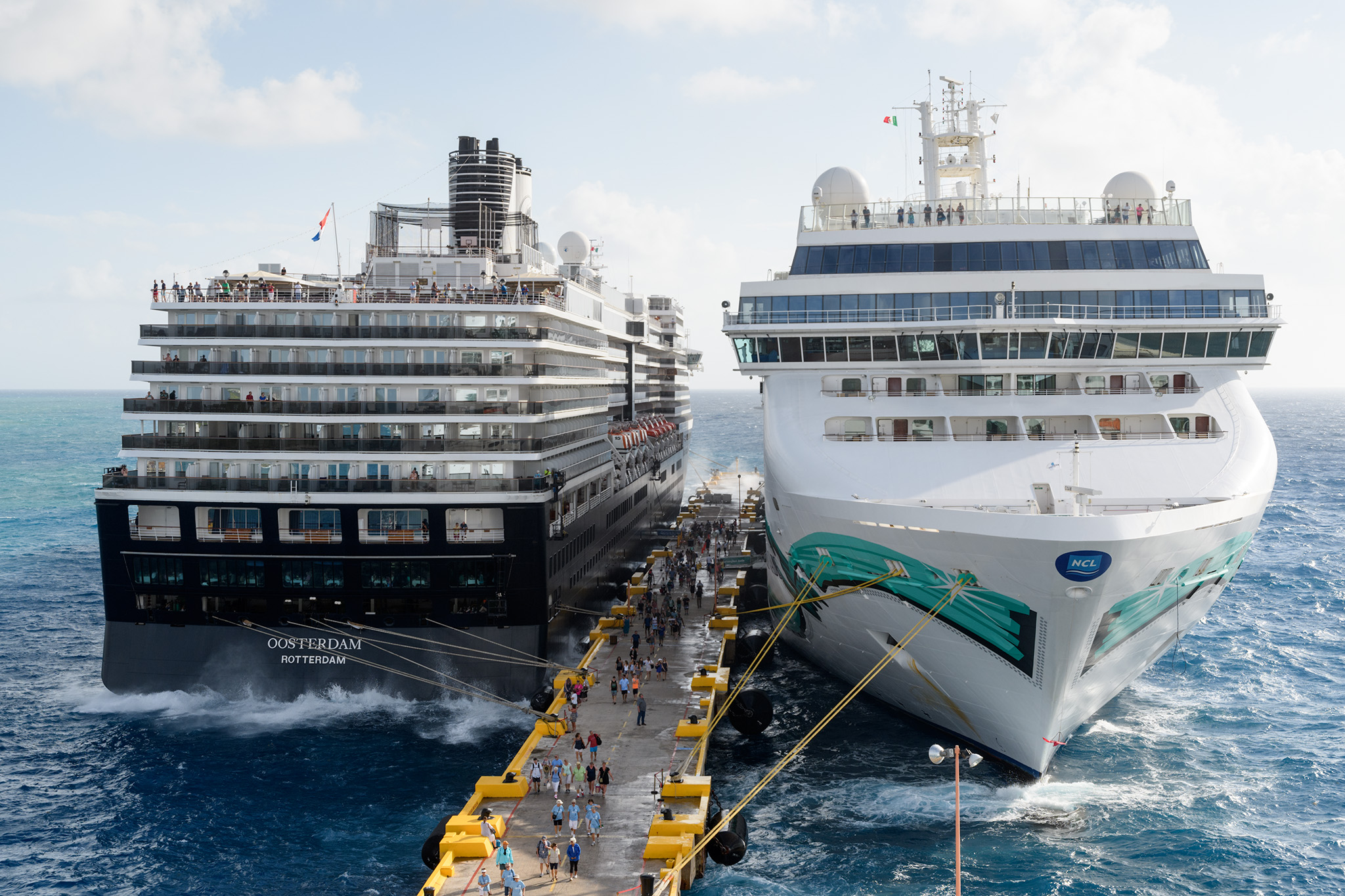 You can see the waves crashing in on the other ships, and spraying up onto the dock, but their gangways were set against the waves which made it safer. 