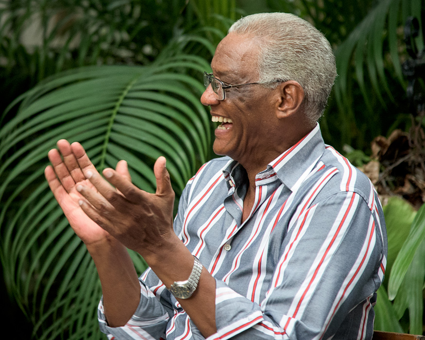 A local musician who connects young jazz acts with Americans coming to learn about Cuban Jazz reacts with joy to his protegees set.