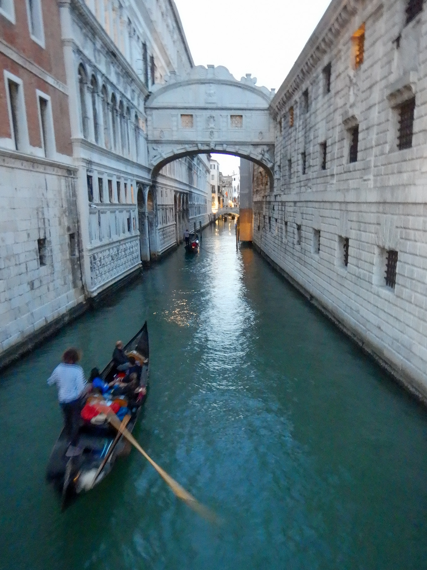 Dozens of gondolas full of tourists wend their way in the canals near St Marks Square.