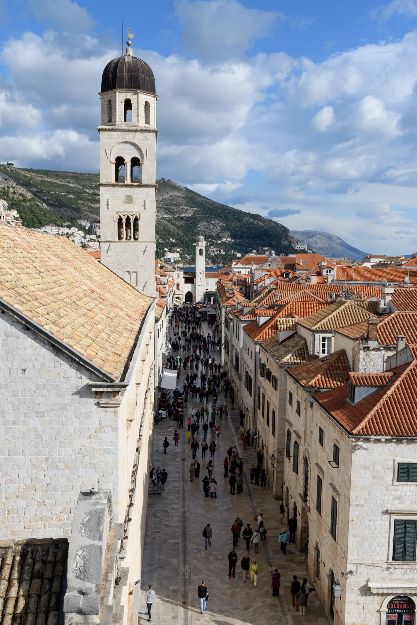 The Stradun from above on the walls, with views of the Sponza Palace in the background and the near tower of the Franciscan Monastary in the foreground.