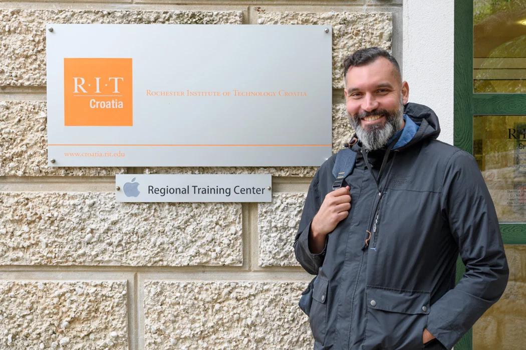 Bozidar standing in front of his alma mater, and coincidentally, the alma mater of our daughter!