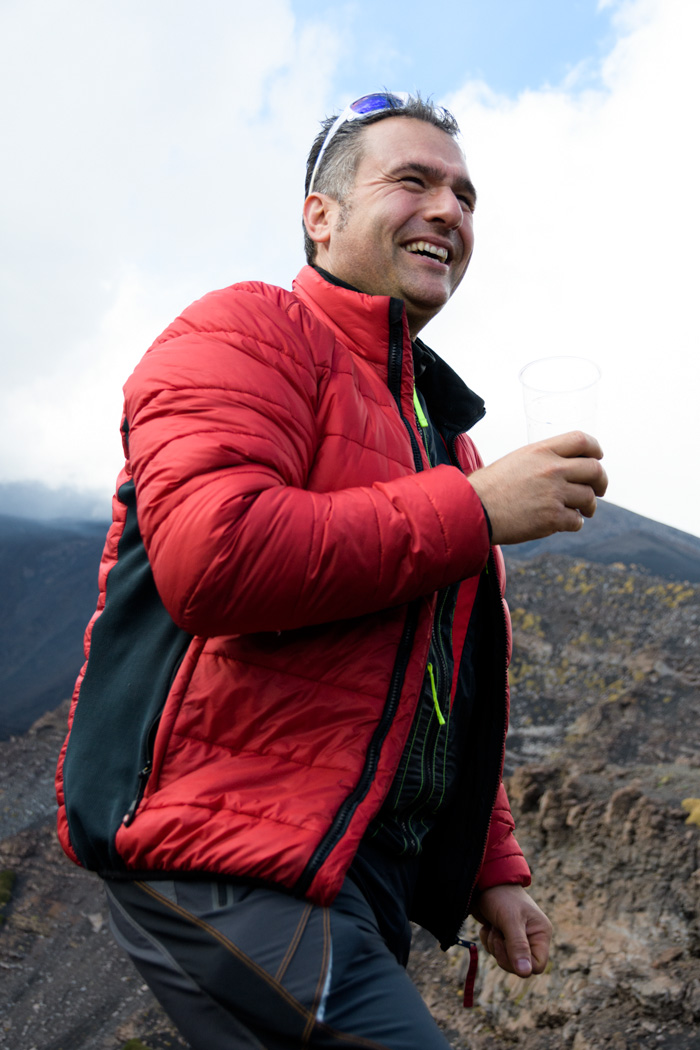 Guliano enjoys a glass of wine with his love- Etna!