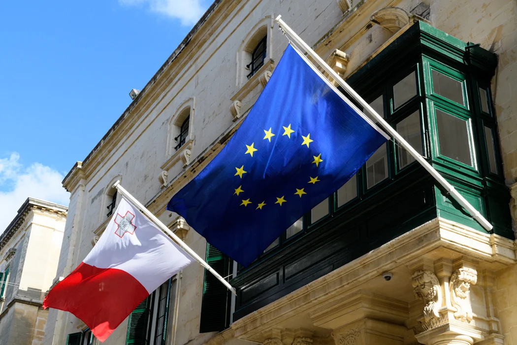 A Maltese balcony on Republic Street flies the EU and Matlese flags. 