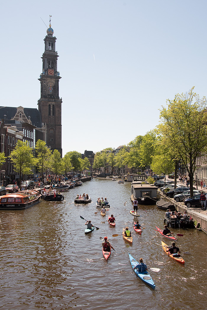 Westerkerk looms over guests on a kayaking tour on the canals