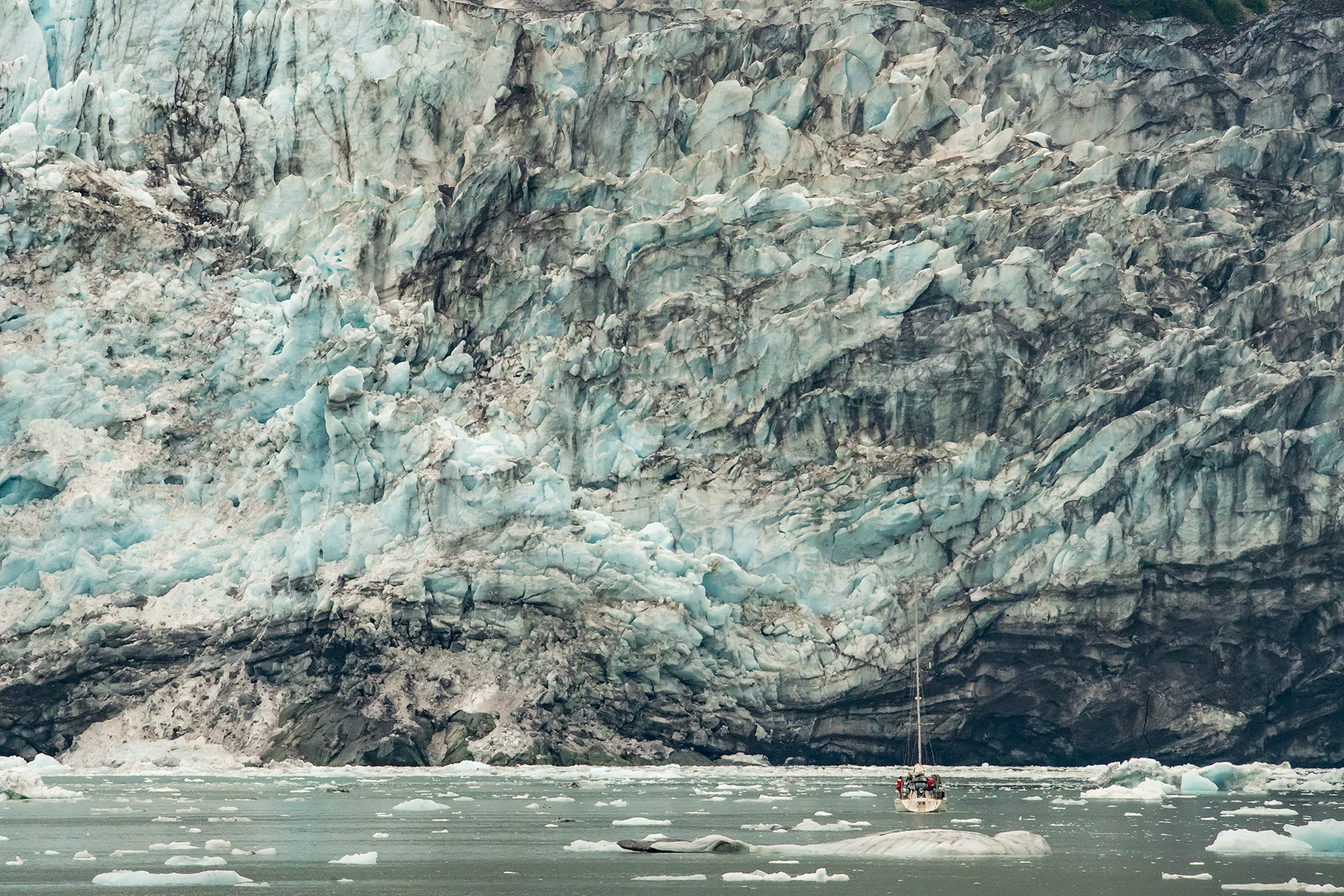 Can you spot the sailboat? This 25-40 foot sailboat is dwarfed by the glacier!