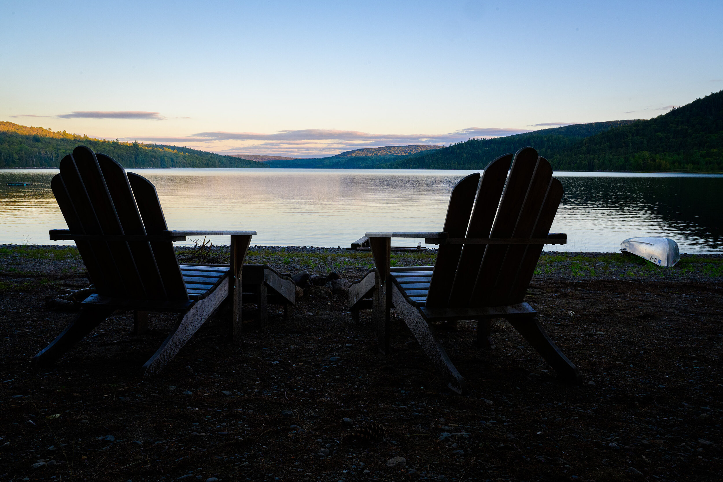 Adirondack chairs on the shore 