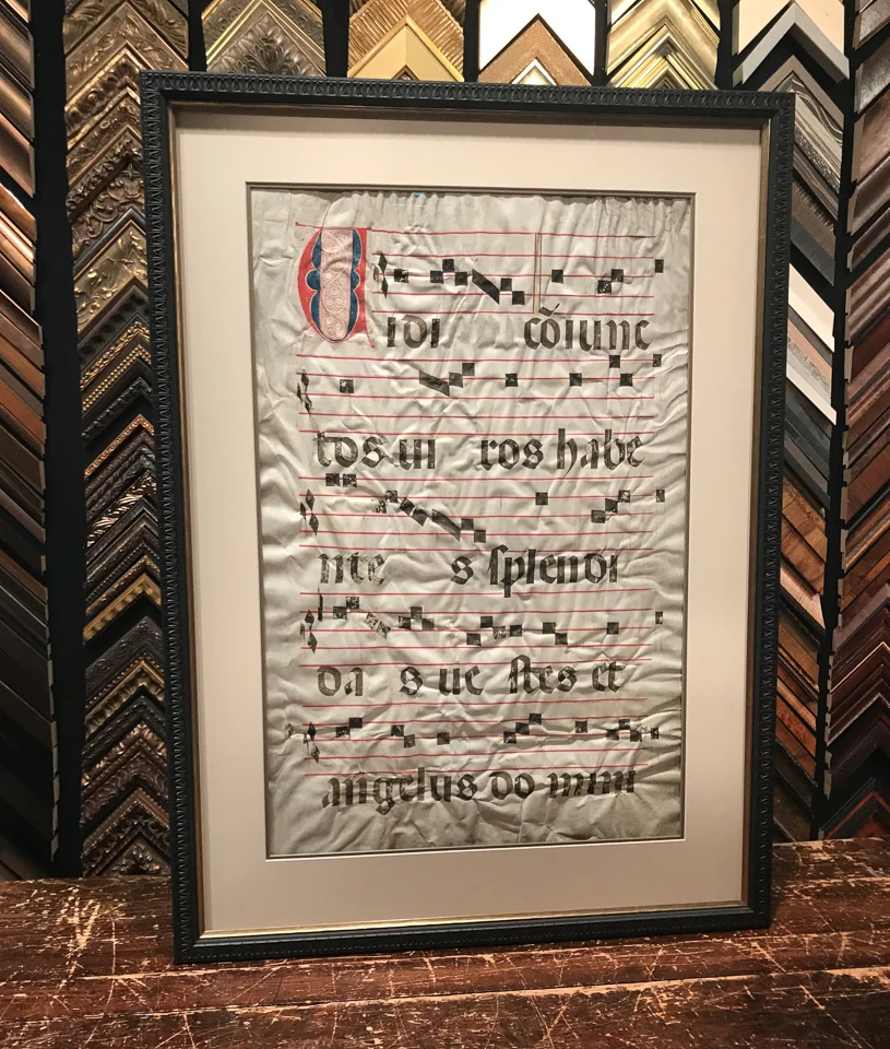 Music inked onto sheepskin parchment framed double sided.
