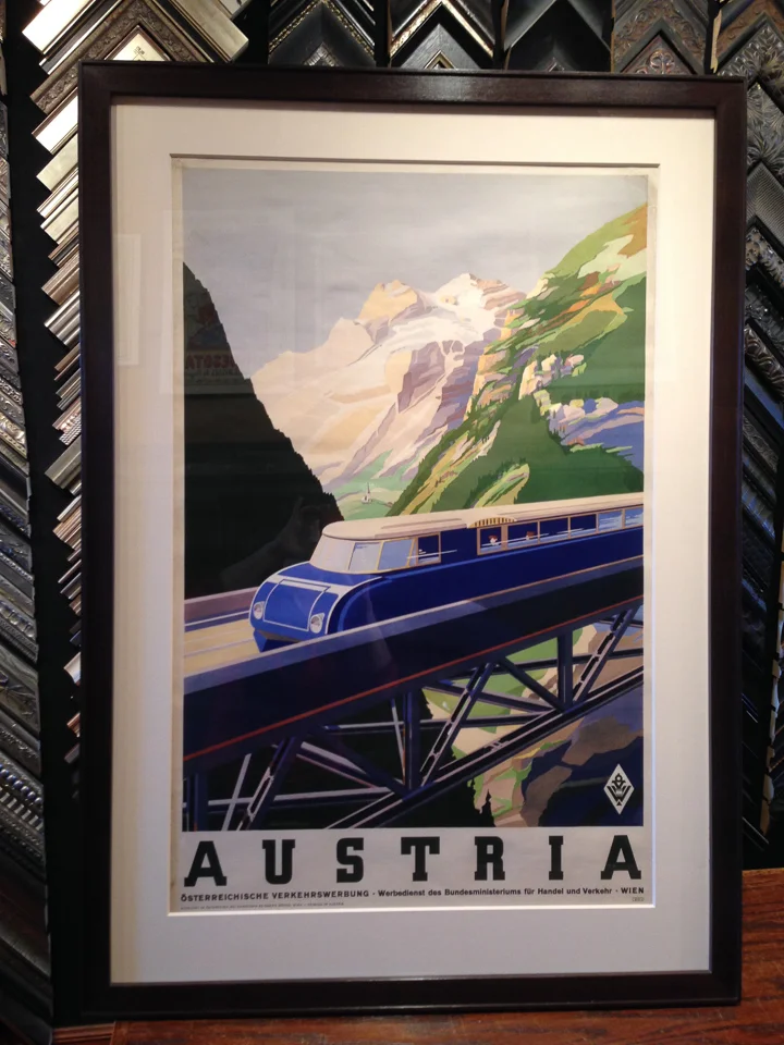 Vintage travel poster framed in ebony walnut.