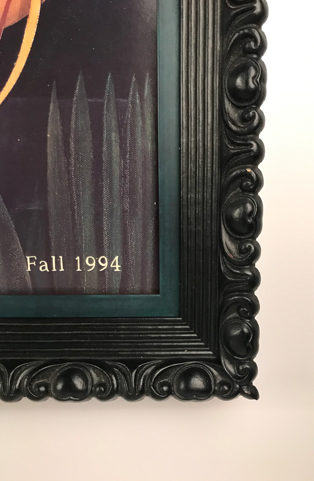 Detail of ornate black with oxidized peacock insert.
