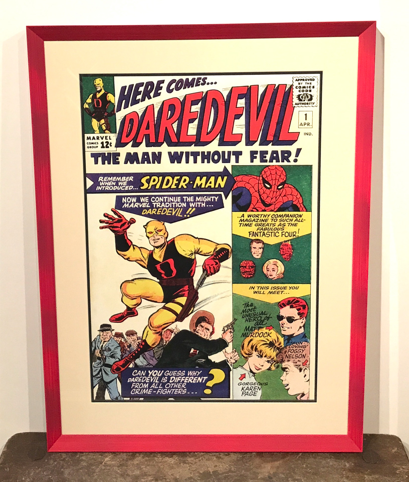 Fun Daredevil print framed in red.