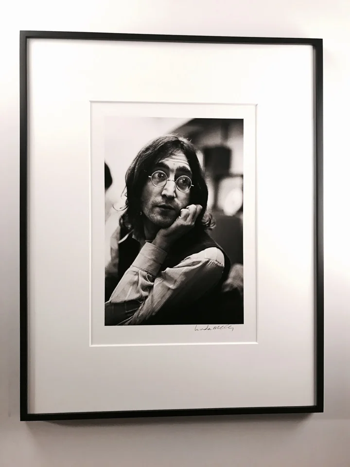 Beautiful image of John Lennon framed classically in a closed-corner black with 8 ply matting.