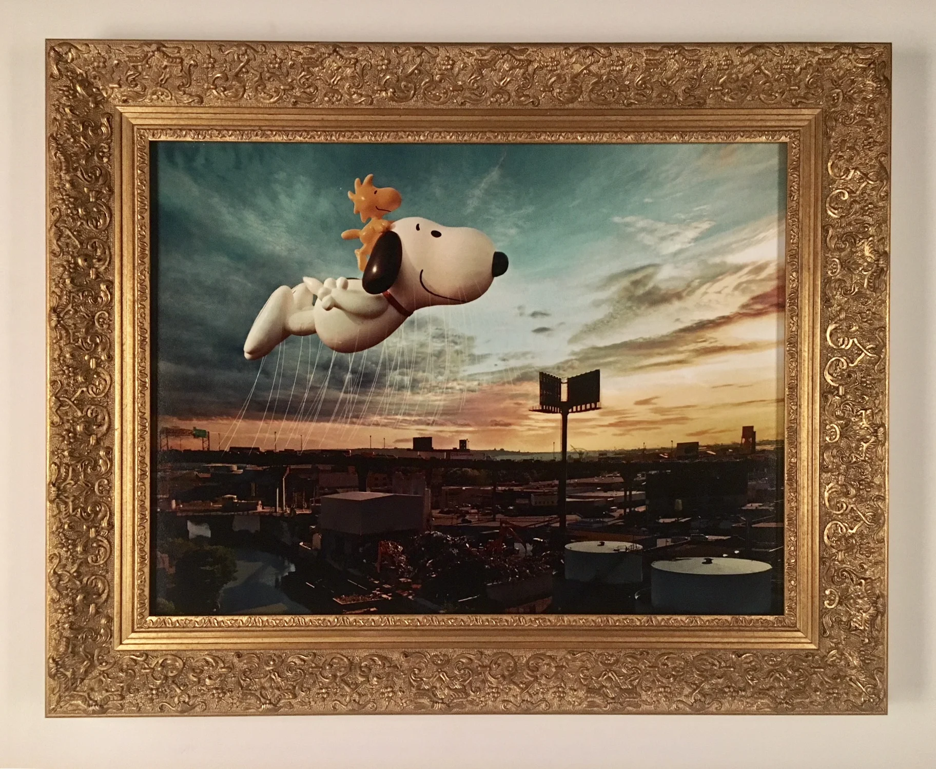 Photograph of Thanksgiving Day float framed in ornate water gilded frame.