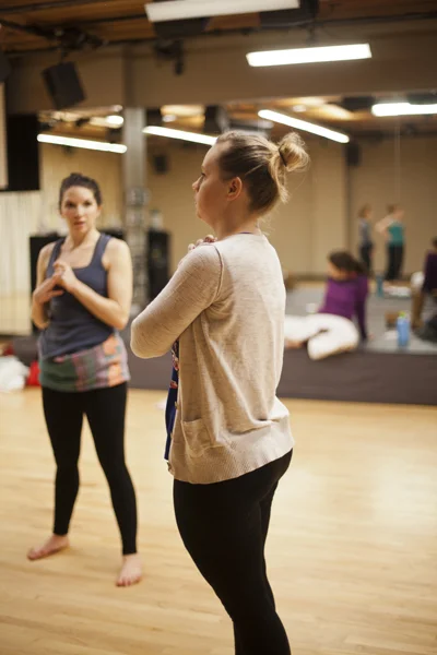 Artistic Director Holly Logan addressing the dance company members during rehearsal. Also pictured (from left to right): Dancers CarliAnn Forthun, Ciara McCormack, Jessica Mego & Lindsay Johns. Photo courtesy of S. Weissbach Photography .