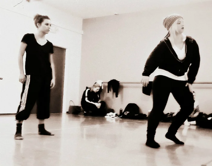 Artistic Director Holly Logan goes over choreographic nuances with dancer, Madeline Cameron during rehearsal. Photo courtesy of S. Weissbach Photography .