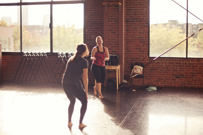 Holly Logan & dancer Heather Smith enjoy a moment of laughter during rehearsals for "Solos in Three." Photo courtesy of S. Weissbach Photography . 