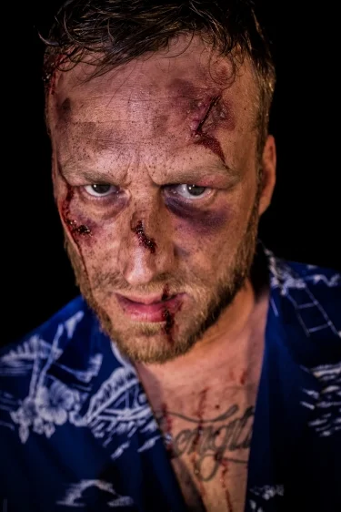 John as "Tyler"; Special Effects Makeup by: Corey Elmore