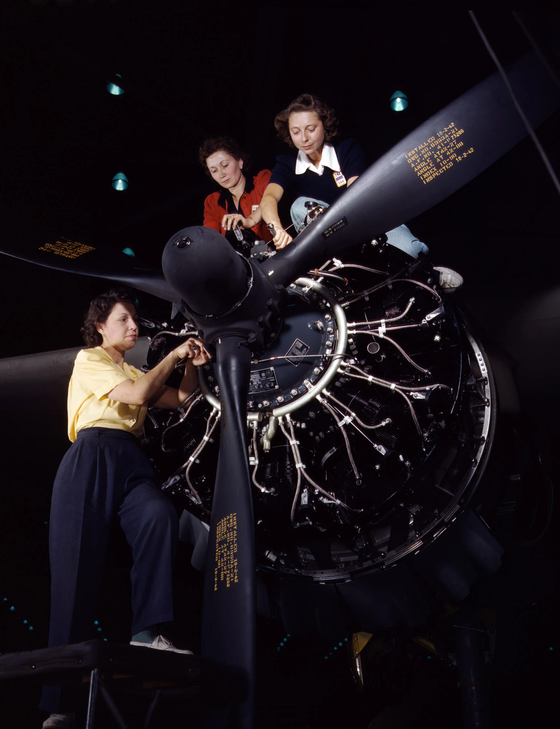 Precise engine installation duties at Douglas Aircraft Company, Long Beach, California. Photographer: Alfred T. Palmer