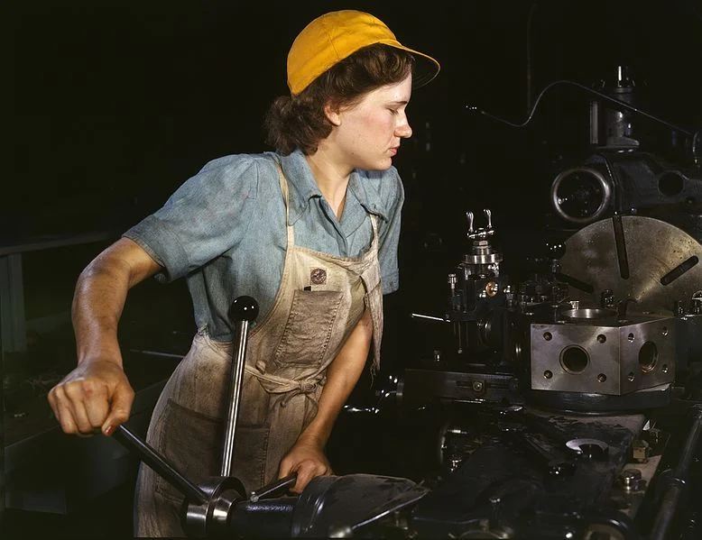 A woman operating a turret lathe (1942). Photographer: Howard R. Hollem