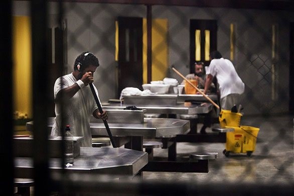 from the series Lost in Guantánamo, Detainees at Camp 6 clean the common area Tim Dirven, Panos Pictures