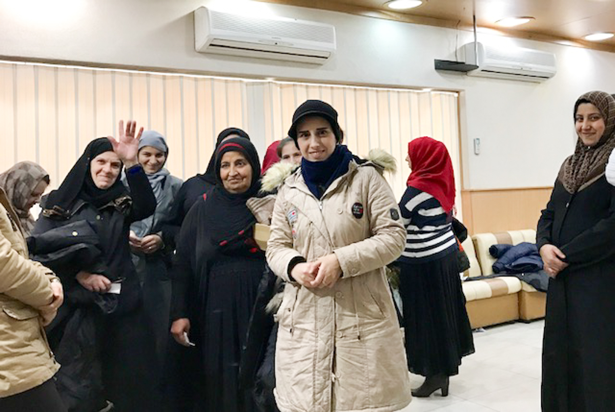 Refugee women at a different distribution center in Bekaa Valley