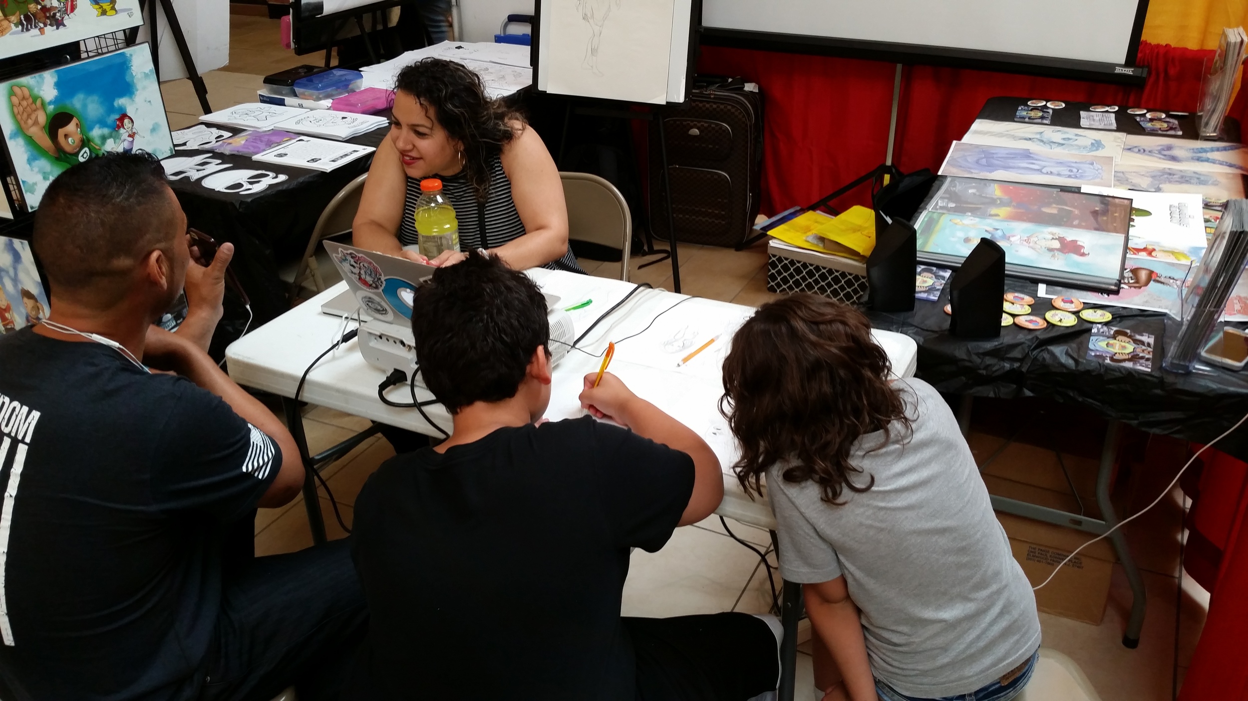 Ashley Gonzales draws with partipants of the first ever Fred Con!