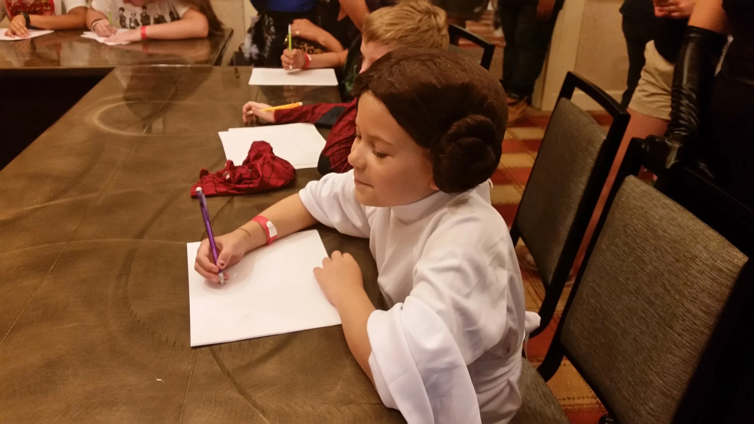 A Princess Leia Cosplayer draws a fox during Keir Lyles 