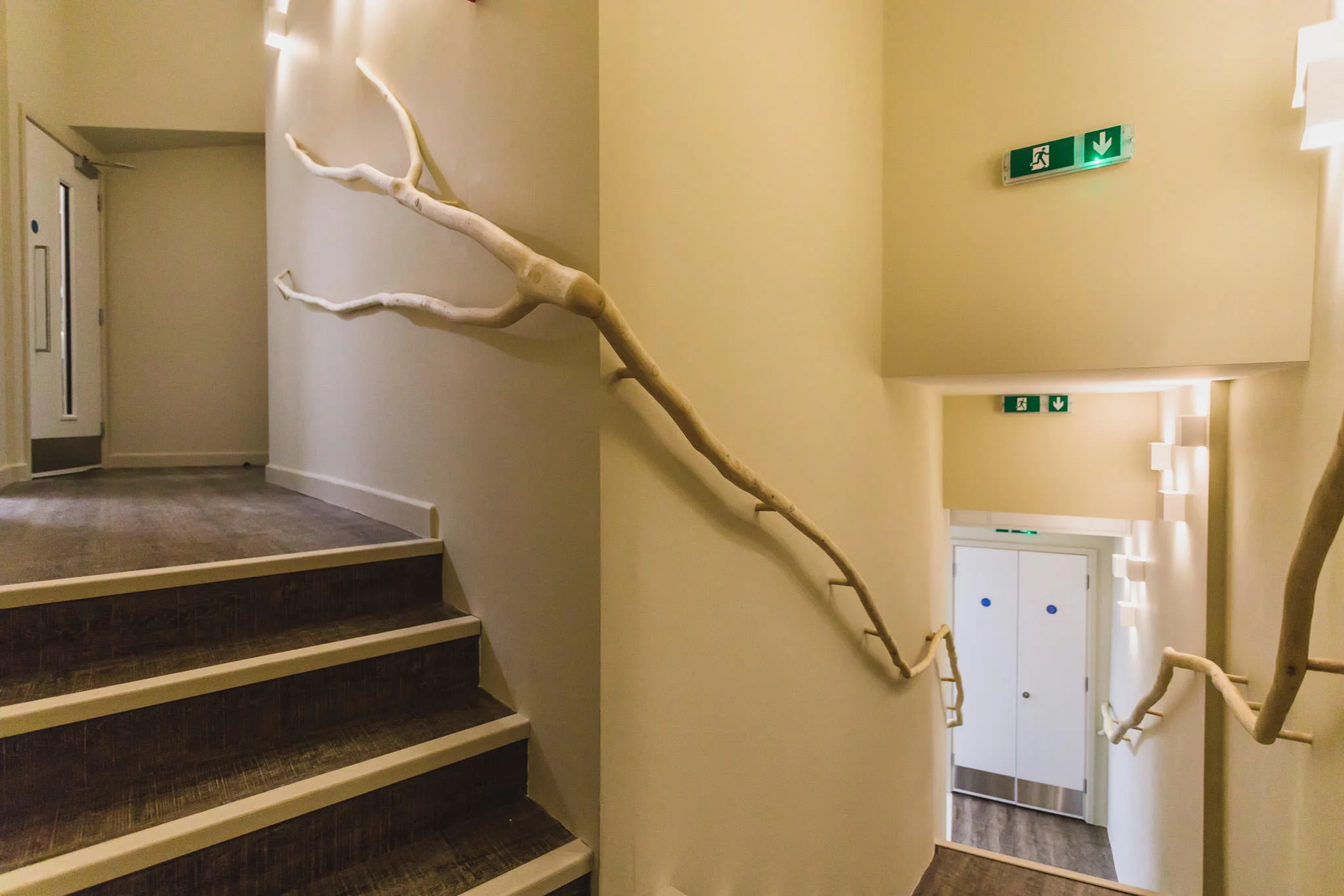 The ash handrail was from locally sourced wood and flows up the stairs in a sculptural fashion