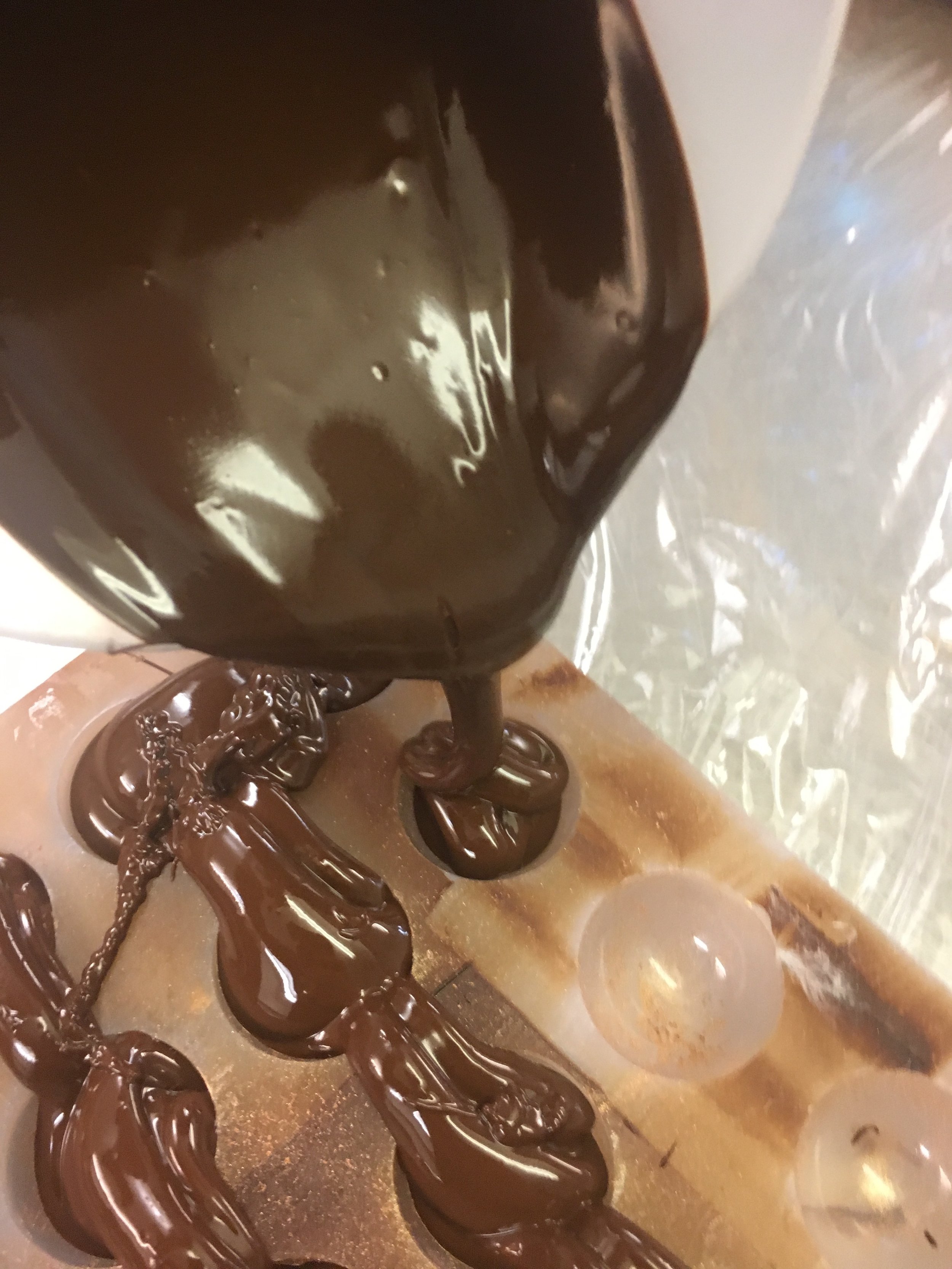 Pouring chocolateinto moulds