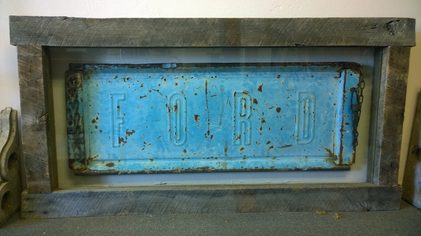 Our customer came in with a vintage Ford tailgate that she wanted to make into an art piece for her home. Using reclaimed wood from U.S. Reclaimed, this work of art was created. 