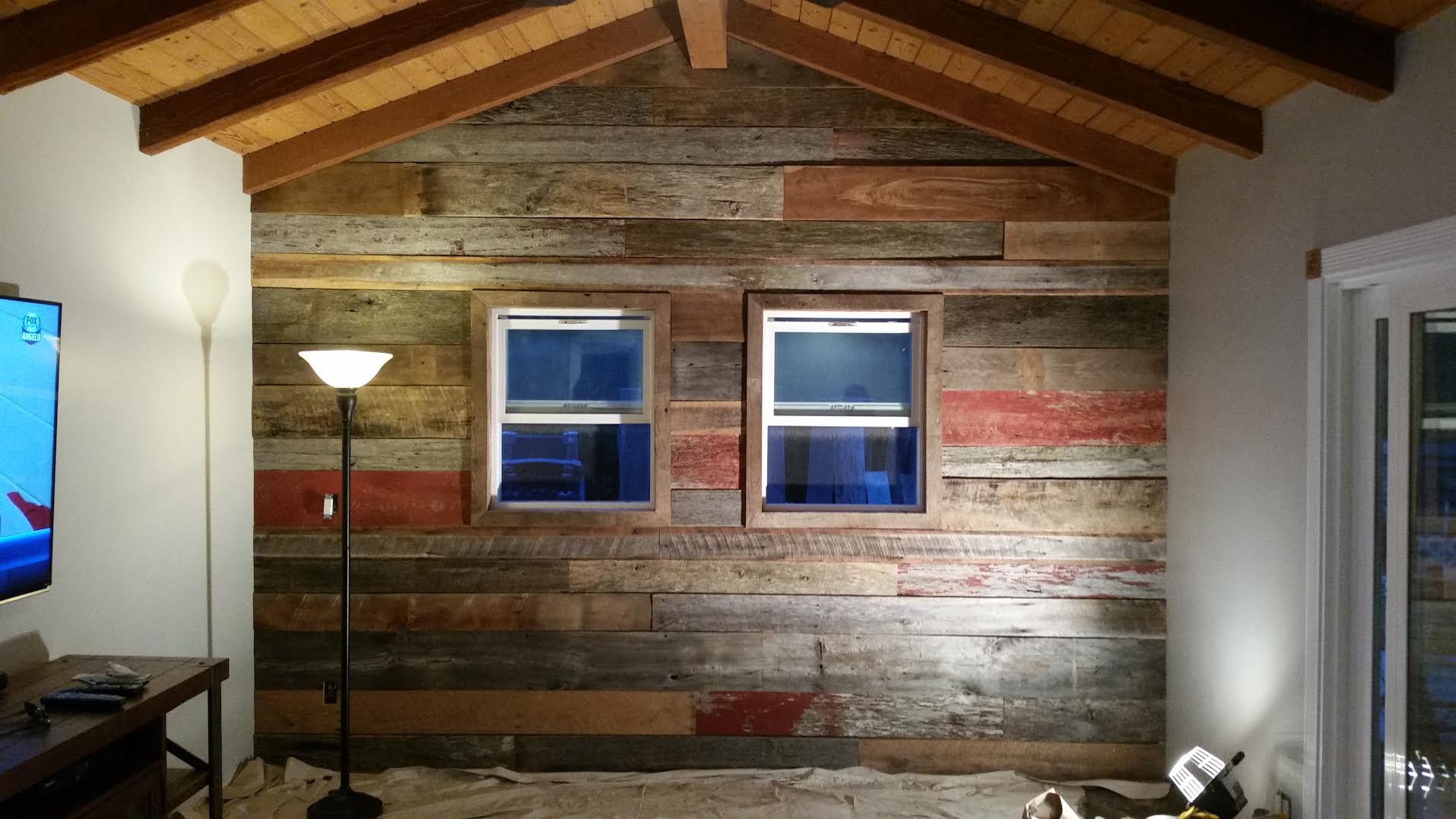 Andrew Farmer of Farmer Construction & Plumbing sent us this picture of the final result of all the mixed reclaimed wood he purchased from U.S. Reclaimed. He came in with an idea for a wall for one of his clients, picked out some barn boards & created this beautiful accent wall with window casing. "Thank you all at US Reclaimed for your wonderful service to our family and your guidance through the picking out of your reclaimed barn siding in leading to such a beautiful wall within our home. It was a blast installing it and we are looking forward to the warm feel we get to experience on a daily basis. We love it! Thanks again for all of your help! Andrew and Nicolle Farmer" "