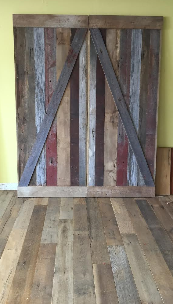 The finished product ready for pick up! Our customer came in 4 weeks ago, discussed a design with Ben for doors for their walk in closet . They picked out their pieces from our vintage lumber racks & chose some red patina barn board from our Michigan barn deconstruction to add a pop of color. They turned out beautifully & can't wait to see a pic of them installed in her home!