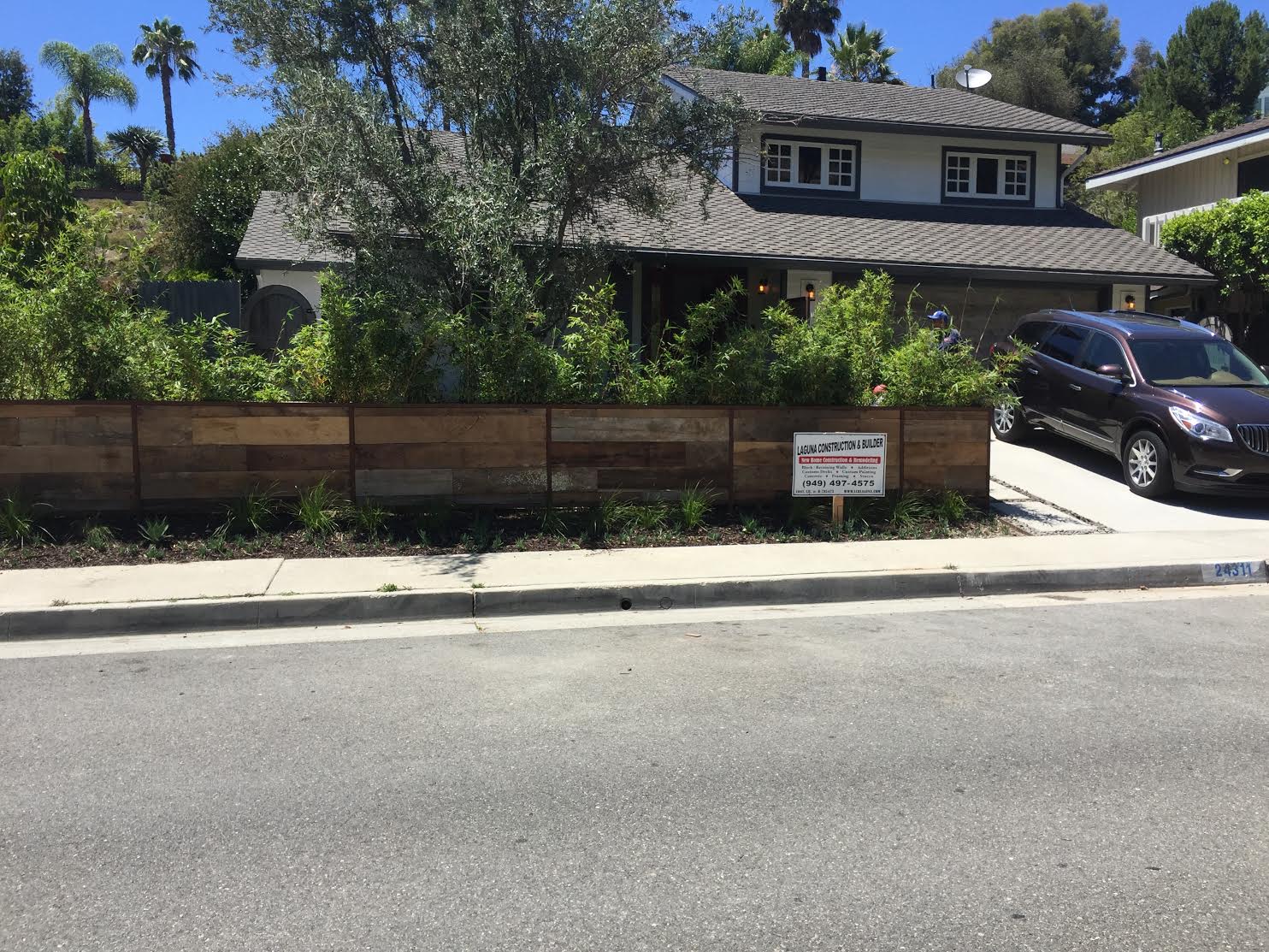 Reclaimed wood is not just for interior design! This customer bought their reclaimed wood material here at the U.S. Reclaimed store front right from our lumber racks. Her contractor & metal fabricator did a great job of showcasing how our vintage barn boards can customize the exterior of your home & increase it's curb appeal!