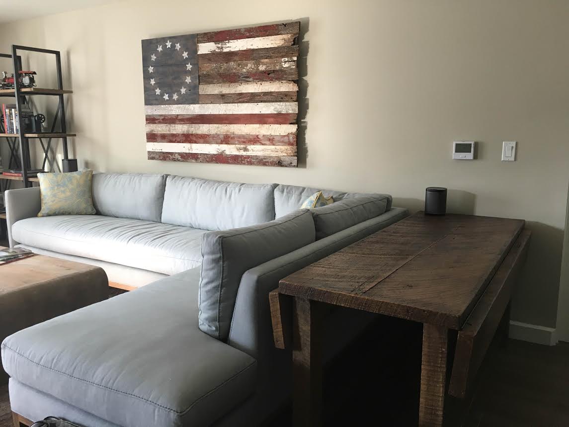 American flag made from reclaimed wood barn boards. Custom accent table designed with drop leaf. 