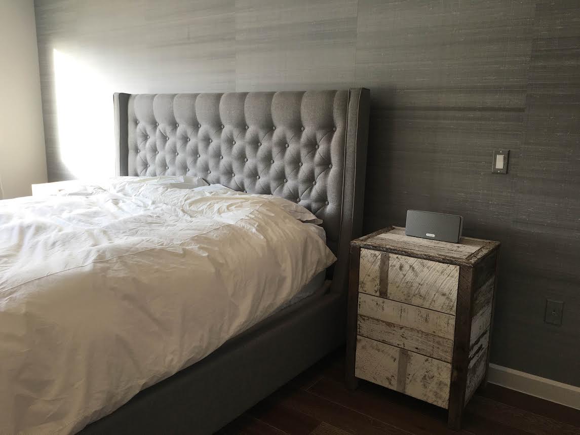 Nightstands designed with door and shelves inside.