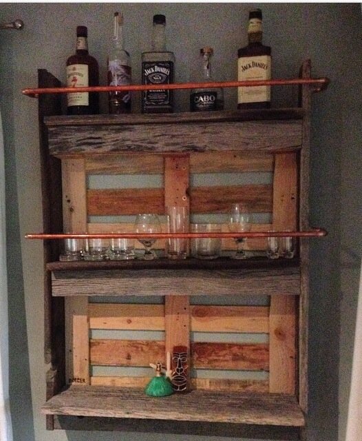 The awesome wall bar Ben helped me make for my husbands bday. Reclaimed grey wood from his shop. Came out badass. - Megan B.